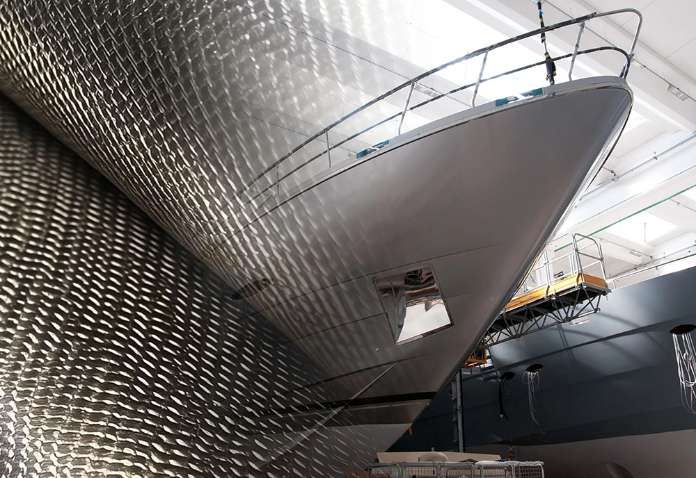 Close-up of recyclable composite material layers replacing traditional fibreglass in marine construction.